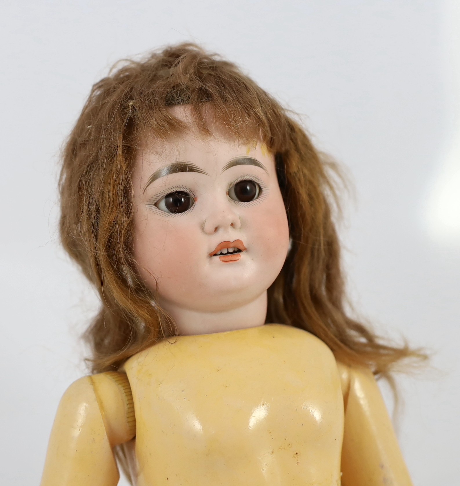 An Armand Marseille bisque doll, German, circa 1894, 20in.